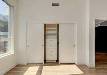 a room with a closet and a window